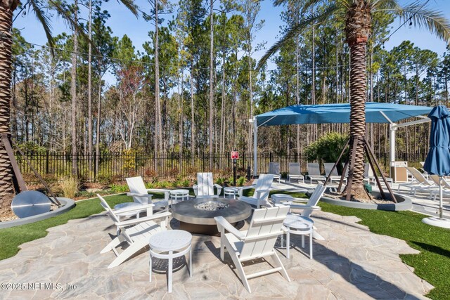 613 Witty Banter Ct, Yulee, FL 32097 - view of patio with an outdoor fire pit