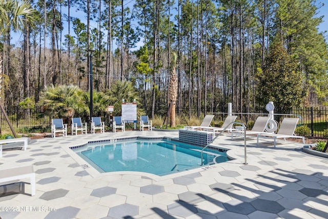 613 Witty Banter Ct, Yulee, FL 32097 - community pool with a patio area