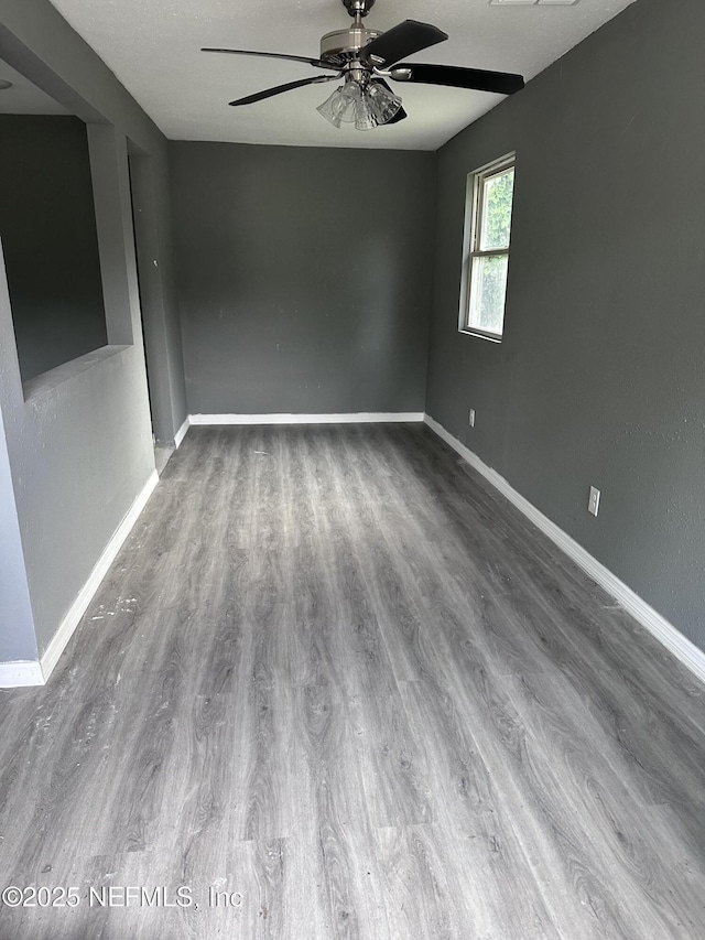9846 Highland Ave, Jacksonville, FL 32208 - spare room featuring ceiling fan and wood finished floors