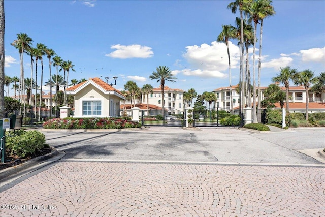 201 S Ocean Grande Dr Unit 104, Ponte Vedra Beach, FL 32082 - view of road with a gate, curbs, a gated entry, and a residential view