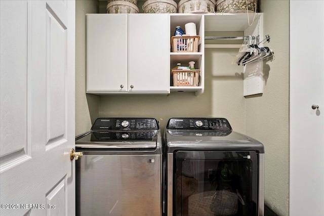201 S Ocean Grande Dr Unit 104, Ponte Vedra Beach, FL 32082 - laundry room featuring washer and clothes dryer and cabinet space