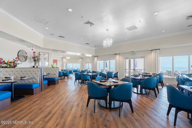 201 S Ocean Grande Dr Unit 104, Ponte Vedra Beach, FL 32082 - dining room with wood finished floors, crown molding, and recessed lighting