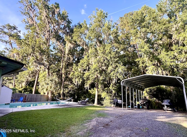 457 Nightingale Rd, Jacksonville, FL 32216 - view of yard with a carport and gravel driveway