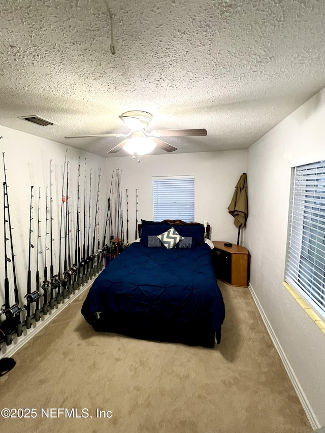 457 Nightingale Rd, Jacksonville, FL 32216 - carpeted bedroom featuring a textured ceiling and ceiling fan