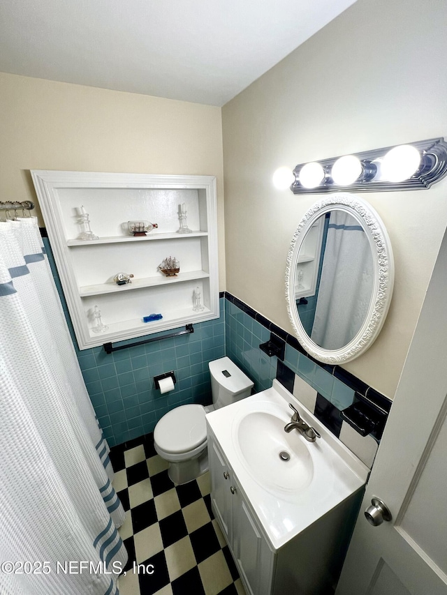 457 Nightingale Rd, Jacksonville, FL 32216 - full bath with tile walls, vanity, tile patterned floors, wainscoting, and curtained shower