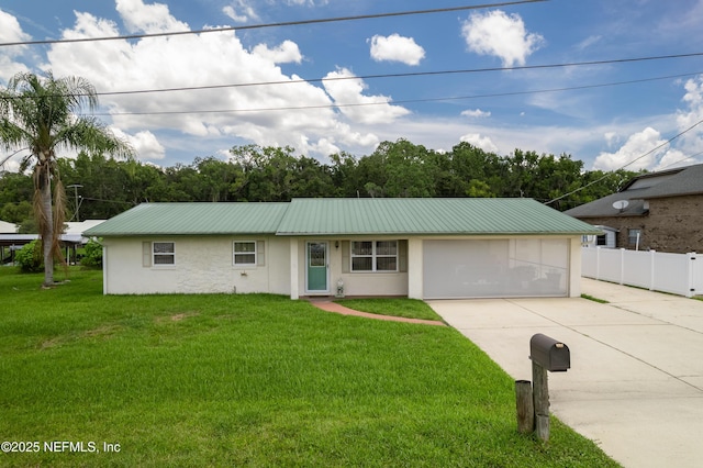 118 Magnolia Dr, East Palatka, FL 32131 - ranch-style house featuring stucco siding, driveway, a metal roof, and an attached garage