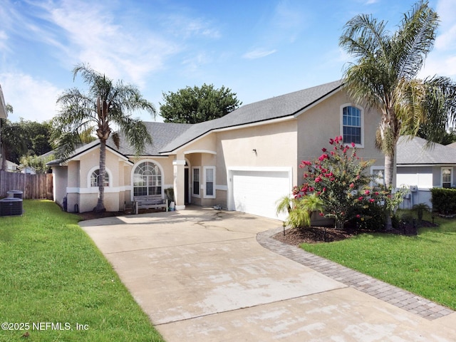 2875 Majestic Oaks Ln, Green Cove Springs, FL 32043 - ranch-style house with concrete driveway, stucco siding, and a garage