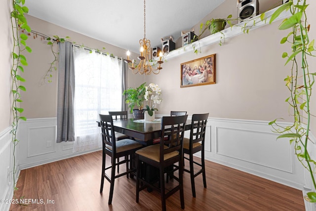 2875 Majestic Oaks Ln, Green Cove Springs, FL 32043 - dining area featuring a chandelier, a decorative wall, wainscoting, and wood finished floors