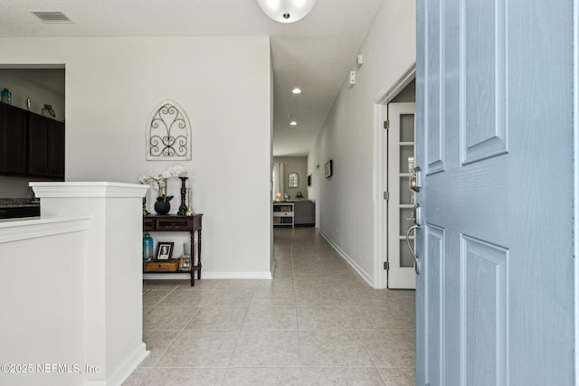 86180 Tranquil Ct, Yulee, FL 32097 - hallway featuring light tile patterned floors and recessed lighting