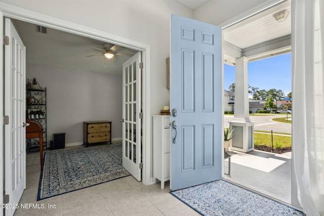 86180 Tranquil Ct, Yulee, FL 32097 - tiled foyer with french doors, healthy amount of natural light, a ceiling fan, and ornate columns