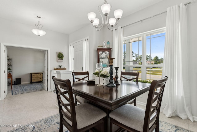 86180 Tranquil Ct, Yulee, FL 32097 - dining space with light tile patterned floors and a chandelier