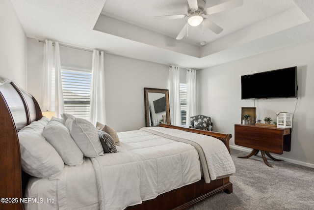 86180 Tranquil Ct, Yulee, FL 32097 - bedroom featuring carpet flooring, a tray ceiling, and ceiling fan