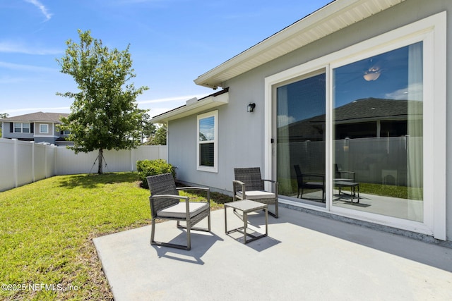 86180 Tranquil Ct, Yulee, FL 32097 - fenced backyard with a patio area