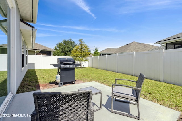 86180 Tranquil Ct, Yulee, FL 32097 - fenced backyard featuring a patio and area for grilling