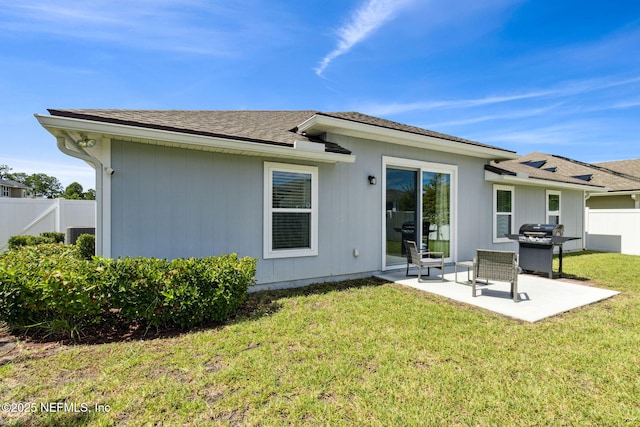 86180 Tranquil Ct, Yulee, FL 32097 - back of house featuring a patio and roof with shingles