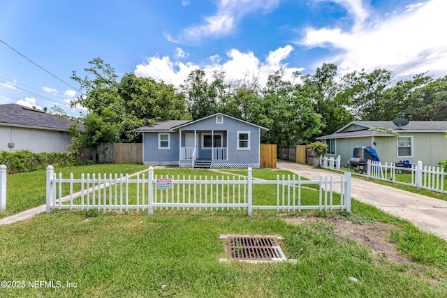 3122 20th St, Jacksonville, FL 32254 - view of front of house with a porch, driveway, and a fenced front yard
