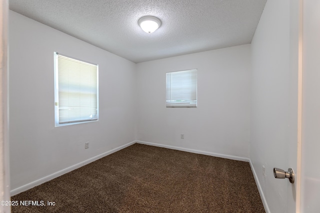 3122 20th St, Jacksonville, FL 32254 - spare room with dark colored carpet and a textured ceiling