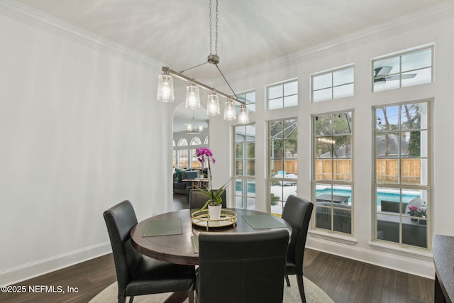 2205 Ashley Ct, Fernandina Beach, FL 32034 - dining space featuring ornamental molding and dark wood-style floors