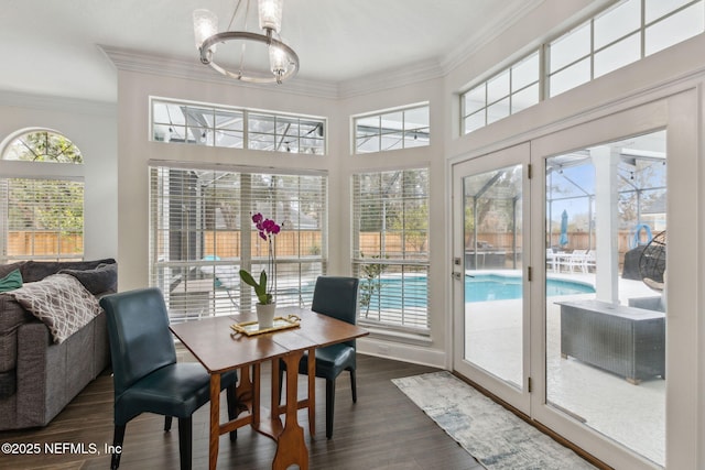 2205 Ashley Ct, Fernandina Beach, FL 32034 - sunroom / solarium featuring a chandelier, ornamental molding, wood finished floors, and french doors