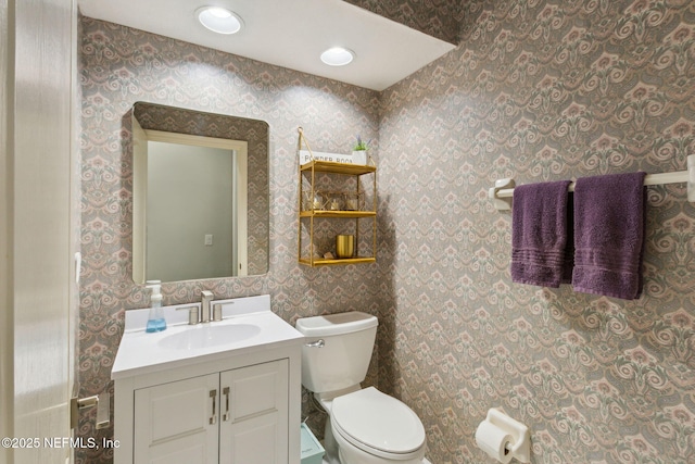 2205 Ashley Ct, Fernandina Beach, FL 32034 - half bath with vanity and wallpapered walls