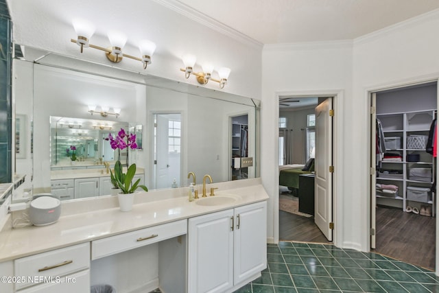 2205 Ashley Ct, Fernandina Beach, FL 32034 - full bathroom featuring vanity, crown molding, tile patterned flooring, and a walk in closet