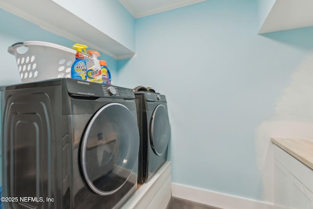 2205 Ashley Ct, Fernandina Beach, FL 32034 - washroom featuring separate washer and dryer, ornamental molding, and dark wood-type flooring
