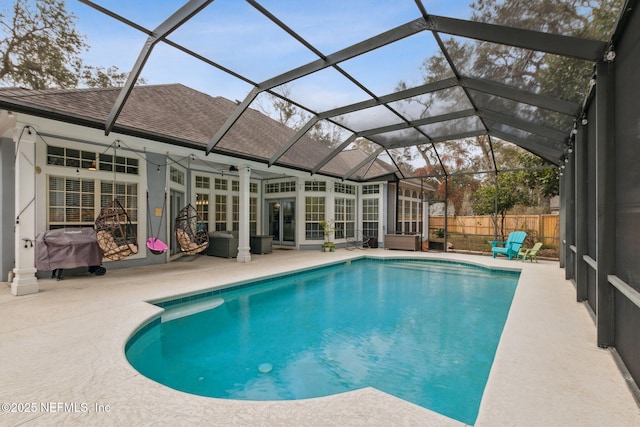 2205 Ashley Ct, Fernandina Beach, FL 32034 - view of swimming pool featuring a patio area, a grill, a lanai, and french doors