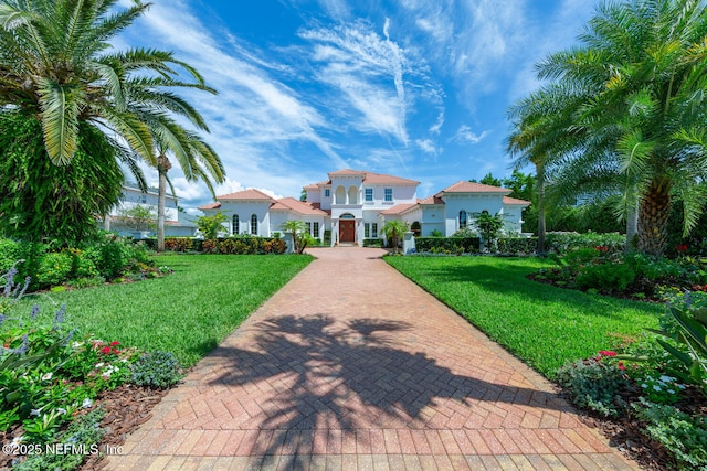 23 Corona Rd, Ponte Vedra Beach, FL 32082 - mediterranean / spanish home with stucco siding and a front yard