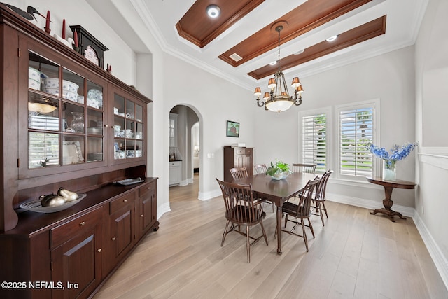 23 Corona Rd, Ponte Vedra Beach, FL 32082 - dining area with arched walkways, a chandelier, ornamental molding, and light wood-style floors