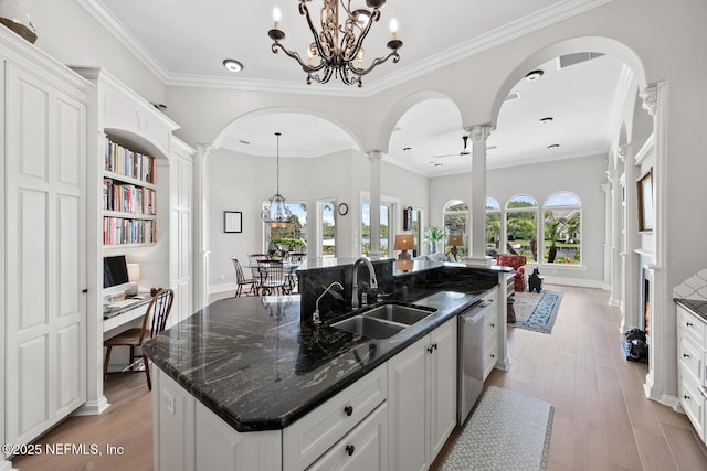 23 Corona Rd, Ponte Vedra Beach, FL 32082 - kitchen featuring ornate columns, arched walkways, a chandelier, and crown molding