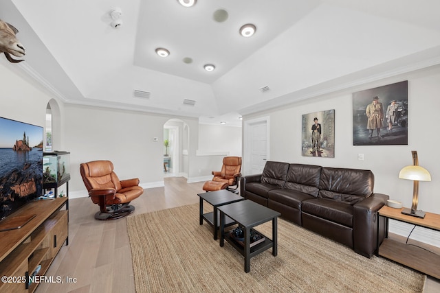 23 Corona Rd, Ponte Vedra Beach, FL 32082 - living area with arched walkways, a raised ceiling, and wood finished floors
