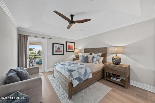 23 Corona Rd, Ponte Vedra Beach, FL 32082 - bedroom featuring access to exterior, a raised ceiling, light wood-style floors, crown molding, and a ceiling fan