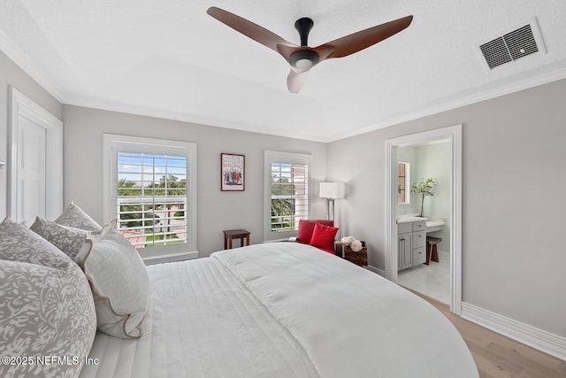23 Corona Rd, Ponte Vedra Beach, FL 32082 - bedroom with light wood-style floors, crown molding, ensuite bath, and a ceiling fan