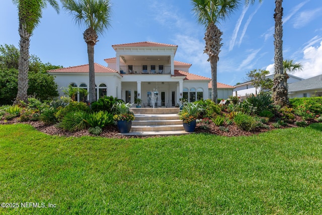 23 Corona Rd, Ponte Vedra Beach, FL 32082 - back of house featuring a tiled roof, a balcony, and a yard