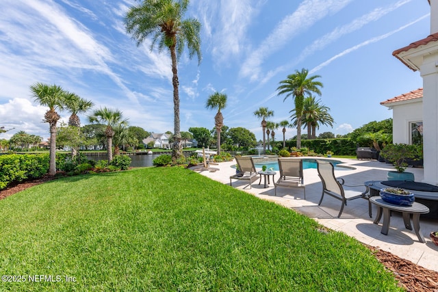 23 Corona Rd, Ponte Vedra Beach, FL 32082 - view of grassy yard featuring a patio area, a pool with connected hot tub, and a water view