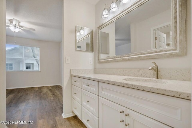 7 Arbor Club Dr Unit 214, Ponte Vedra Beach, FL 32082 - bathroom featuring vanity, wood finished floors, and a ceiling fan