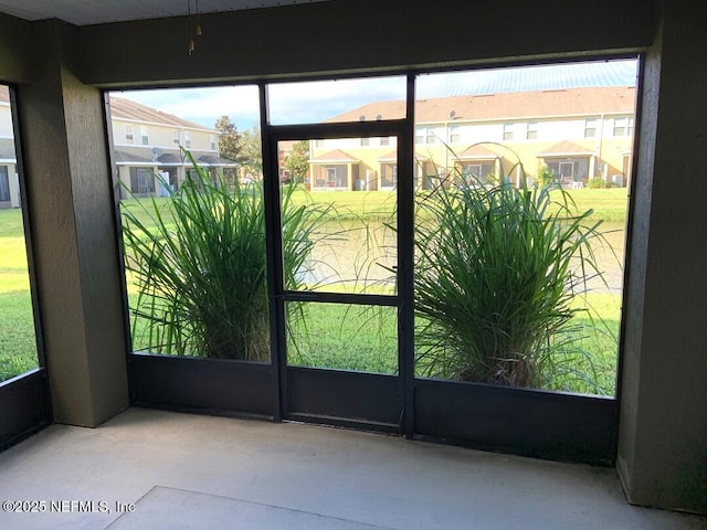 13312 Low Tide Way, Jacksonville, FL 32258 - doorway featuring concrete floors and a residential view