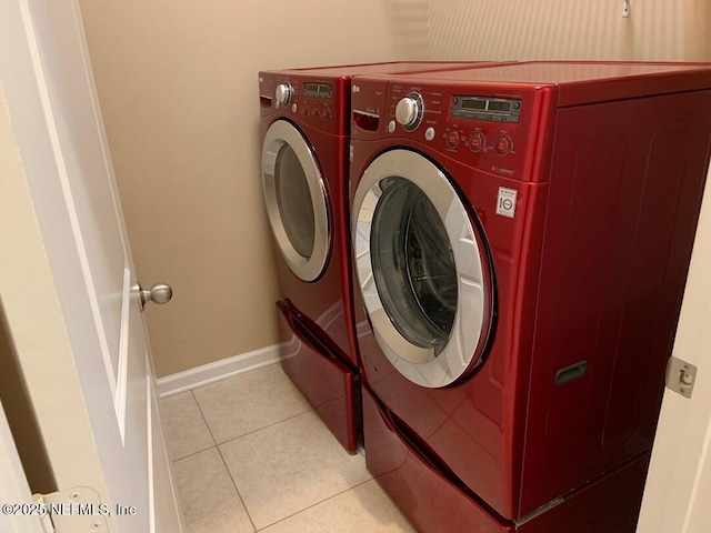 13312 Low Tide Way, Jacksonville, FL 32258 - laundry room featuring independent washer and dryer and light tile patterned floors