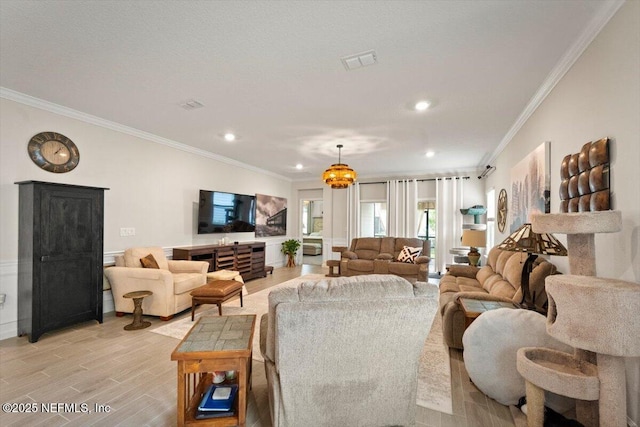 75013 Pondside Ln, Yulee, FL 32097 - living area featuring crown molding, light wood-style flooring, and recessed lighting