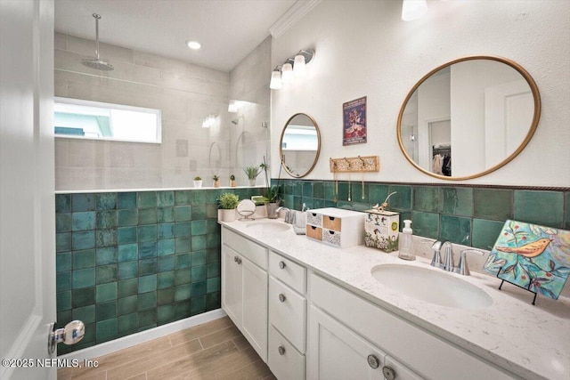 75013 Pondside Ln, Yulee, FL 32097 - bathroom featuring tile walls, double vanity, walk in shower, and wood finished floors