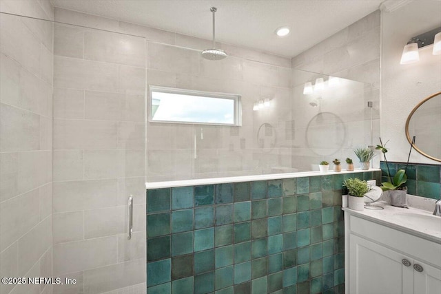 75013 Pondside Ln, Yulee, FL 32097 - full bathroom with a shower stall, vanity, and tile walls