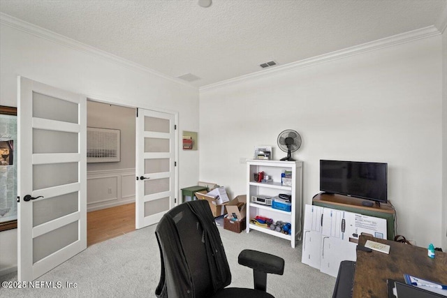 75013 Pondside Ln, Yulee, FL 32097 - office with french doors, carpet flooring, ornamental molding, and a textured ceiling