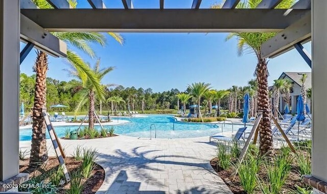 75013 Pondside Ln, Yulee, FL 32097 - community pool featuring a patio area