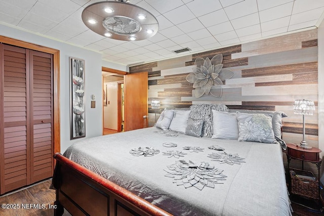 2510 Cesery Blvd, Jacksonville, FL 32211 - bedroom with wood finished floors, a closet, and wooden walls
