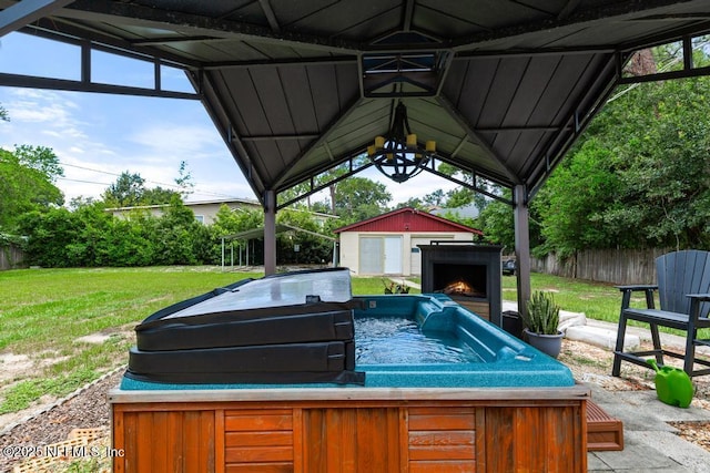 2510 Cesery Blvd, Jacksonville, FL 32211 - view of patio featuring a hot tub and an outdoor structure