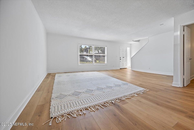 695 A1A Unit 146, Ponte Vedra Beach, FL 32082 - living room with wood finished floors and a textured ceiling