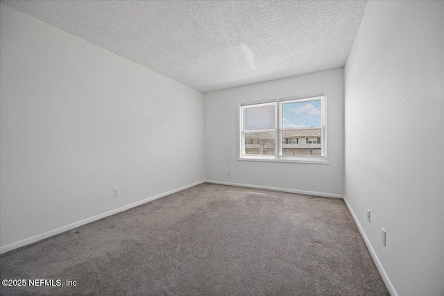 695 A1A Unit 146, Ponte Vedra Beach, FL 32082 - carpeted spare room with a textured ceiling and baseboards