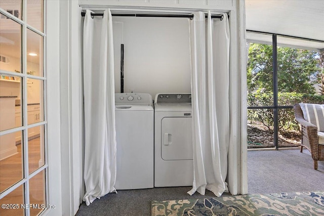 695 A1A Unit 146, Ponte Vedra Beach, FL 32082 - washroom with washer and clothes dryer and dark colored carpet