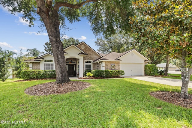1208 Kyle Way S, Saint Johns, FL 32259 - view of front of home featuring a front lawn, driveway, an attached garage, and brick siding