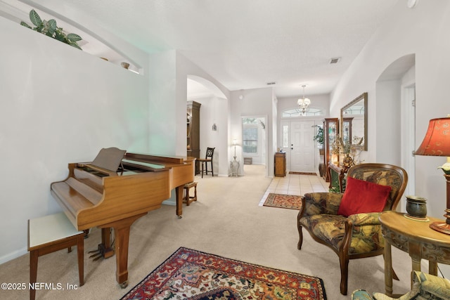1208 Kyle Way S, Saint Johns, FL 32259 - foyer with arched walkways and light carpet